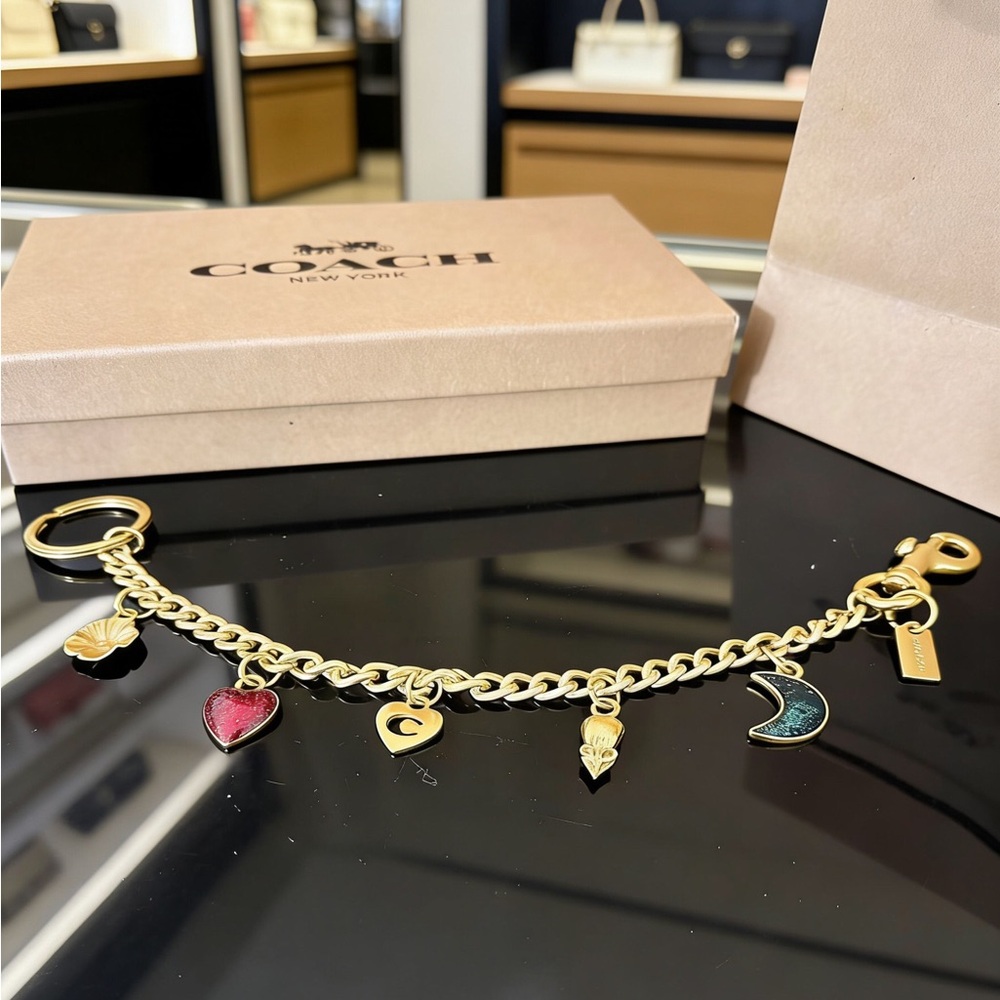 Coach Gold-Tone Charm Bracelet with Red and Teal Enamel Charms